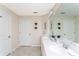 Bright bathroom with double sinks, a large mirror, and decorative accents for a fresh, clean feel at 3151 Paradox Cir # 108, Kissimmee, FL 34746