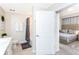 A view into a bathroom connected to a bedroom, showcasing the ensuite design and clean, modern features at 3151 Paradox Cir # 108, Kissimmee, FL 34746