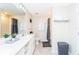 Contemporary bathroom featuring double sinks, modern fixtures, and ample storage space at 3151 Paradox Cir # 108, Kissimmee, FL 34746