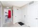 Hallway leading to room with vibrant decor, with white walls, and neutral flooring at 3151 Paradox Cir # 108, Kissimmee, FL 34746