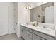 Modern bathroom features double sinks, gray cabinets, quartz countertop, and a large mirror at 3295 Bailey Ann Dr, Ormond Beach, FL 32174