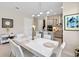 Elegant dining room featuring a modern table with seating for six, complemented by stylish lighting and décor at 3295 Bailey Ann Dr, Ormond Beach, FL 32174
