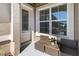 Inviting front porch featuring stylish seating, a window, and the home's entrance for welcoming curb appeal at 3295 Bailey Ann Dr, Ormond Beach, FL 32174