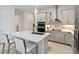 Well-appointed kitchen with a central island, stainless steel appliances, and sleek cabinetry for a contemporary feel at 3295 Bailey Ann Dr, Ormond Beach, FL 32174