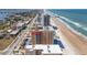 Beautiful aerial view showcases the condo's location near the beach and the pier at 3799 S Atlantic Ave # 1006, Daytona Beach, FL 32118
