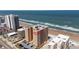 Aerial view of condominium complex, close to beach, with an ocean view at 3799 S Atlantic Ave # 1006, Daytona Beach, FL 32118