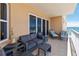 Relax on this inviting balcony featuring comfortable seating and stunning views of the ocean at 3799 S Atlantic Ave # 1006, Daytona Beach, FL 32118