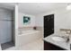 Bathroom featuring shower, large tub, and granite counters at 3799 S Atlantic Ave # 1006, Daytona Beach, FL 32118