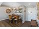 Dining area boasting a modern chandelier and attractive wall decor at 3799 S Atlantic Ave # 1006, Daytona Beach, FL 32118