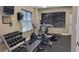 Well-equipped fitness center featuring exercise bikes, treadmill, weights, and a modern design at 3799 S Atlantic Ave # 1006, Daytona Beach, FL 32118