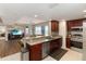Open kitchen features granite countertops and stainless steel appliances adjacent to living area at 3799 S Atlantic Ave # 1006, Daytona Beach, FL 32118