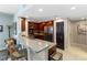 Stylish kitchen with granite counters, stainless appliances, and breakfast bar seating at 3799 S Atlantic Ave # 1006, Daytona Beach, FL 32118