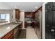 Well-equipped kitchen featuring stainless steel appliances, granite countertops, and ocean view at 3799 S Atlantic Ave # 1006, Daytona Beach, FL 32118
