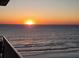 Breathtaking ocean sunrise over calm water, offering a serene and tranquil view at 3799 S Atlantic Ave # 1006, Daytona Beach, FL 32118