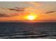 Breathtaking ocean sunrise over calm water, with sunbeams breaking through a cloudscape at 3799 S Atlantic Ave # 1006, Daytona Beach, FL 32118
