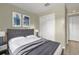 Cozy bedroom featuring a well-made bed, closet space, and natural light at 4108 Drexel Ave, Orlando, FL 32808
