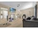 Cozy living room with modern decor, light wood floors, and mounted TV at 4108 Drexel Ave, Orlando, FL 32808