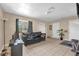 Comfortable living room with tile flooring, natural light, and neutral paint, creating a welcoming space at 4108 Drexel Ave, Orlando, FL 32808
