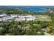 Aerial view displays the property within the neighborhood, nearby lakes and a school complex at 4464 Willow Wind Ct, Orlando, FL 32835