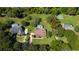 Aerial view showcasing a property with multiple homes each with their own screened-in pool and a basketball court at 4464 Willow Wind Ct, Orlando, FL 32835