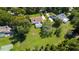 Aerial view of single Gathering home with pool and large backyard including fire pit, and sport court at 4464 Willow Wind Ct, Orlando, FL 32835