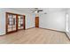 Spacious bedroom with wood-look floors, ceiling fan, and ample natural light at 4464 Willow Wind Ct, Orlando, FL 32835