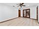 Large bedroom features wood-look floors and glass doors at 4464 Willow Wind Ct, Orlando, FL 32835