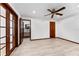 Bedroom featuring wood-look floors and access to en-suite bathroom at 4464 Willow Wind Ct, Orlando, FL 32835