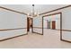 Open dining room showcasing tile flooring, decorative trim, and a contemporary chandelier at 4464 Willow Wind Ct, Orlando, FL 32835