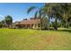 Beautiful home featuring manicured landscaping, lush green lawn, and grand curb appeal at 4464 Willow Wind Ct, Orlando, FL 32835