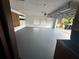Spacious garage with painted floor, overhead lighting and garage door with automatic door opener at 4464 Willow Wind Ct, Orlando, FL 32835