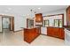 Well-lit kitchen features an island, granite countertops, and stainless-steel appliances at 4464 Willow Wind Ct, Orlando, FL 32835