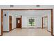 Bright and spacious living area with large windows, tile flooring, and detailed trim at 4464 Willow Wind Ct, Orlando, FL 32835