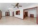 Expansive living space offering tile flooring, wood trim, and convenient access to a wet bar area at 4464 Willow Wind Ct, Orlando, FL 32835