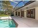 Screened in pool with patio and view of the house at 4464 Willow Wind Ct, Orlando, FL 32835
