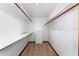 Walk-in closet with shelving and storage for clothing and accessories at 4464 Willow Wind Ct, Orlando, FL 32835