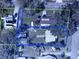 This aerial view shows the layout of the property and its surroundings, including a boat, cars, and landscaping at 4816 Davisson Ave, Orlando, FL 32804