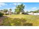 Large backyard featuring lush greenery, a shed, and a barbecue area, perfect for Gathering gatherings and outdoor activities at 4816 Davisson Ave, Orlando, FL 32804
