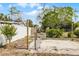 Fenced backyard with a partially paved area leading to a shed, offering privacy and potential for outdoor enjoyment at 4816 Davisson Ave, Orlando, FL 32804