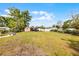 Expansive backyard showcasing a shed and well-maintained lawn, perfect for recreation and gardening at 4816 Davisson Ave, Orlando, FL 32804