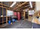 Spacious garage with exposed rafters, a ceiling fan and multiple storage spaces, suitable for hobbies and projects at 4816 Davisson Ave, Orlando, FL 32804