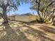 Property with large trees providing shade over the lawn in backyard at 5037 Bermuda Cir # 10, Orlando, FL 32808