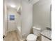 Clean bathroom featuring a modern vanity, subway tile, and wood-look floors at 5037 Bermuda Cir # 10, Orlando, FL 32808
