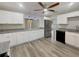 Modern kitchen with white cabinets, stainless steel appliances, and granite countertops at 5037 Bermuda Cir # 10, Orlando, FL 32808