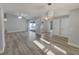 Open living area with fan, access to outdoor pool, and modern lighting at 5037 Bermuda Cir # 10, Orlando, FL 32808
