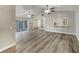 Open living area with fan, access to outdoor pool, and modern lighting at 5037 Bermuda Cir # 10, Orlando, FL 32808