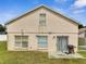 Backyard with grill and sliding door offers outdoor space and access at 5118 Luna Negra Dr, Orlando, FL 32811