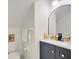 Half-bathroom with decorative mirror, sink, and toilet in a cozy space at 5118 Luna Negra Dr, Orlando, FL 32811