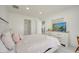 Bedroom with neutral decor, featuring a bed, dresser, and ensuite bathroom access at 5118 Luna Negra Dr, Orlando, FL 32811