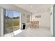 Bright dining area with sliding glass doors to backyard and room for entertaining at 5118 Luna Negra Dr, Orlando, FL 32811